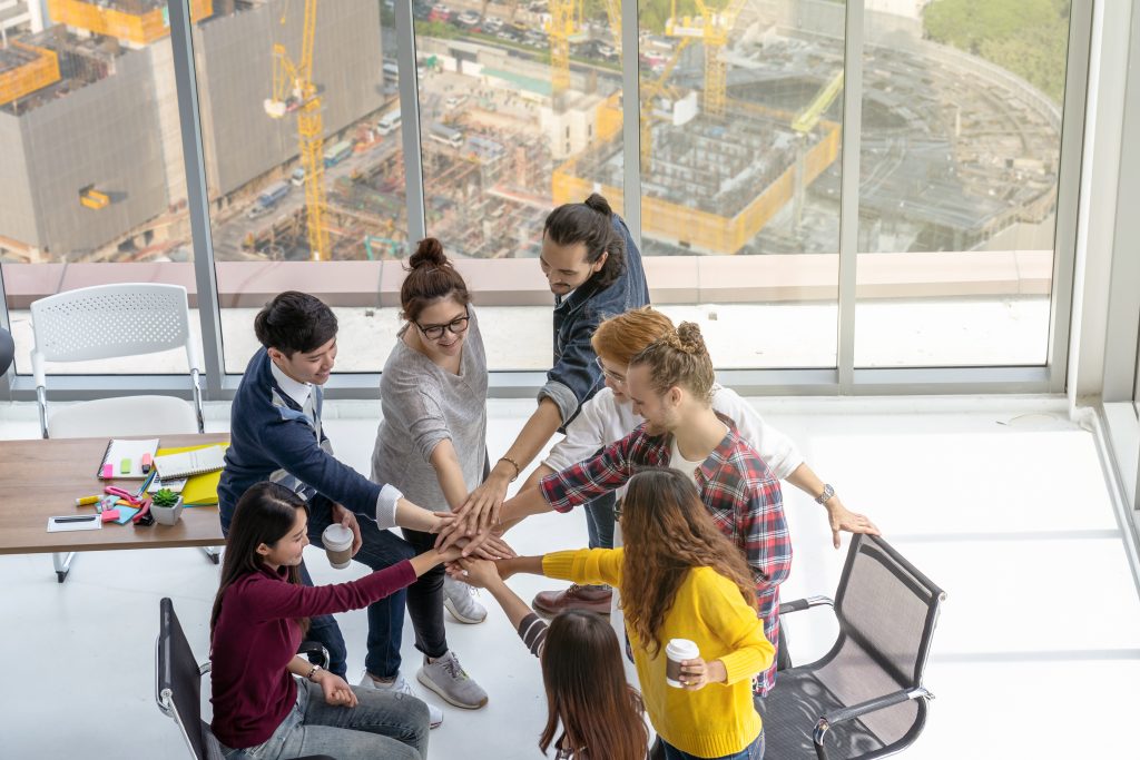 Diverse business team building inclusive workplace culture in NYC
